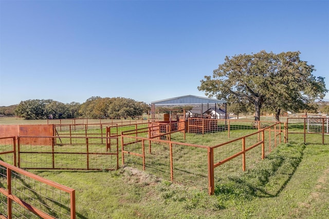 view of play area with a rural view and an outdoor structure