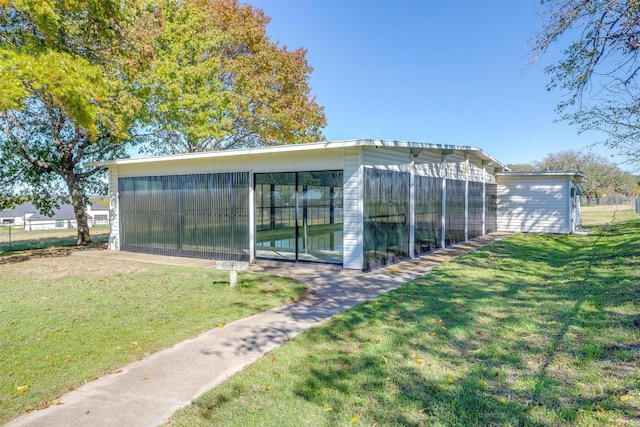 view of outdoor structure with a yard