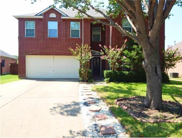 view of front of house featuring central AC unit, a front yard, and a garage