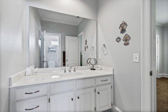 bathroom featuring vanity and ornamental molding