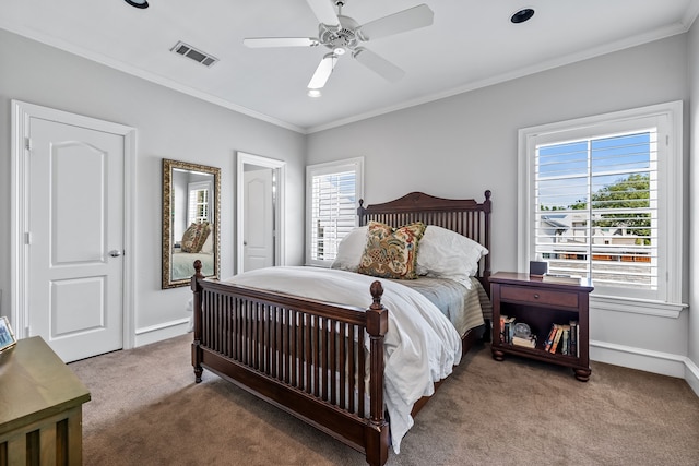 bedroom featuring carpet, ceiling fan, and ornamental molding