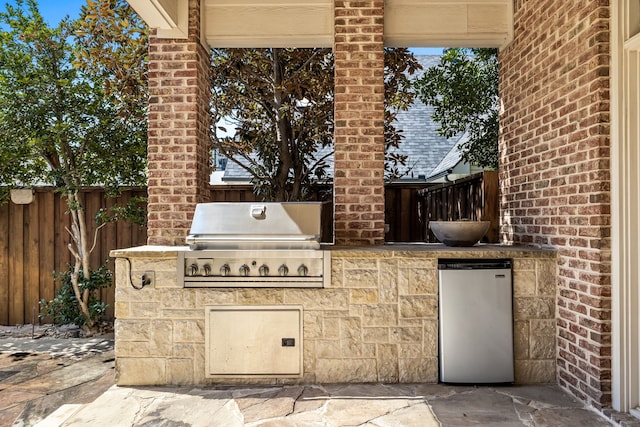 view of patio / terrace with area for grilling and exterior kitchen