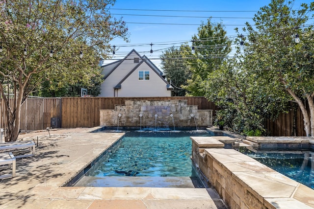 view of swimming pool with pool water feature