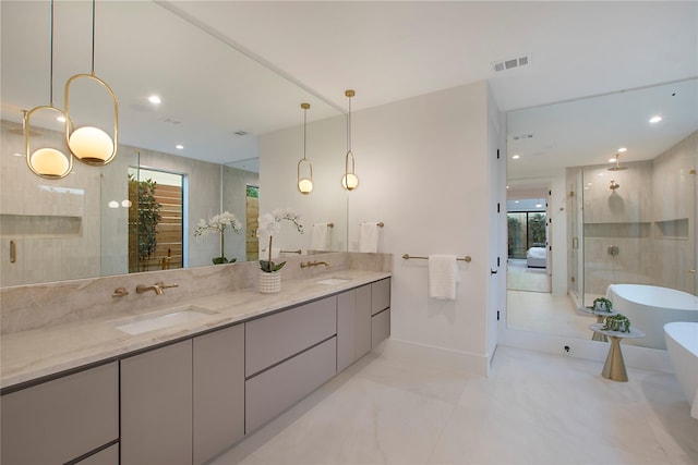 bathroom featuring vanity and shower with separate bathtub