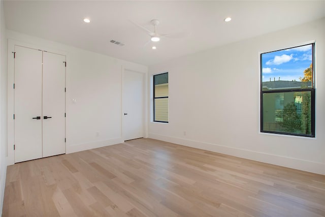 unfurnished bedroom featuring ceiling fan and light hardwood / wood-style flooring