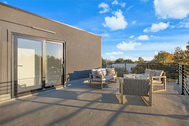 view of patio featuring an outdoor living space and a balcony