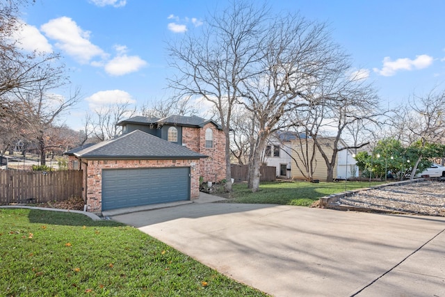 view of front of home with a garage and a front lawn