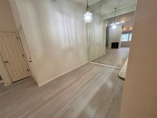 unfurnished dining area with light hardwood / wood-style flooring