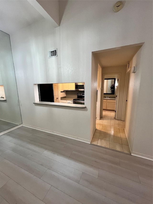 hallway featuring light wood-type flooring