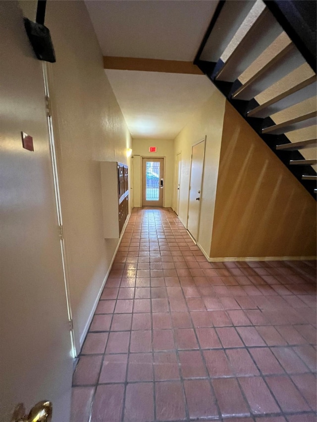 hall featuring tile patterned flooring