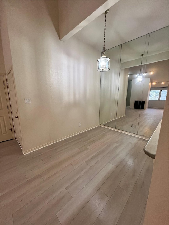 unfurnished dining area with wood-type flooring