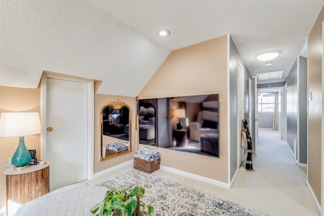 interior space featuring vaulted ceiling and a textured ceiling