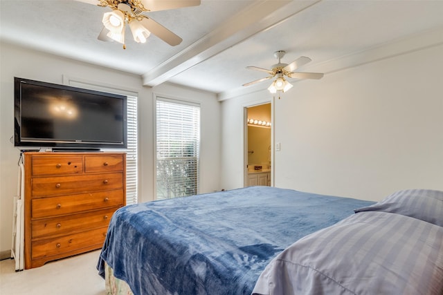 bedroom featuring ceiling fan, ensuite bathroom, beam ceiling, and light carpet