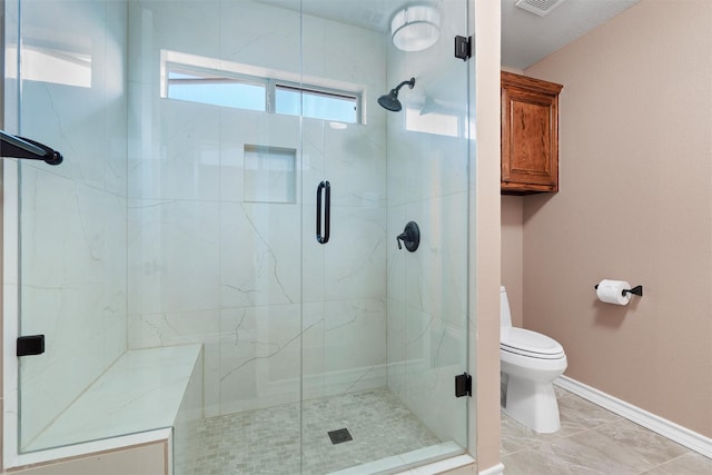 full bath featuring a marble finish shower, toilet, and baseboards