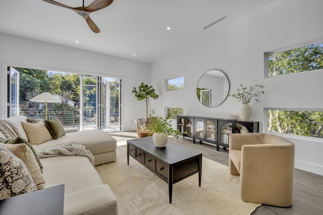 living room featuring ceiling fan and light wood-type flooring