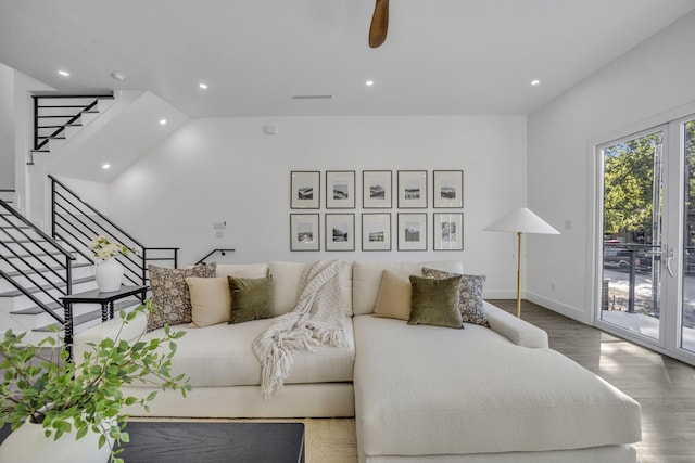 living room featuring ceiling fan and wood-type flooring