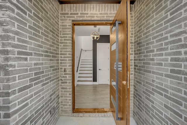 hallway with brick wall