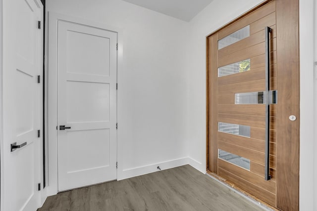 foyer entrance with light wood-type flooring