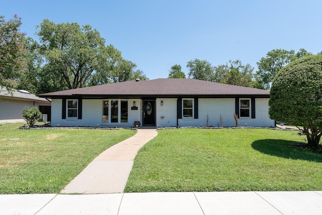 ranch-style home featuring a front yard