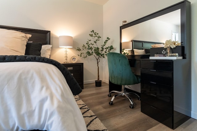 bedroom featuring dark wood-type flooring