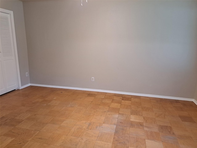 unfurnished room featuring light parquet floors