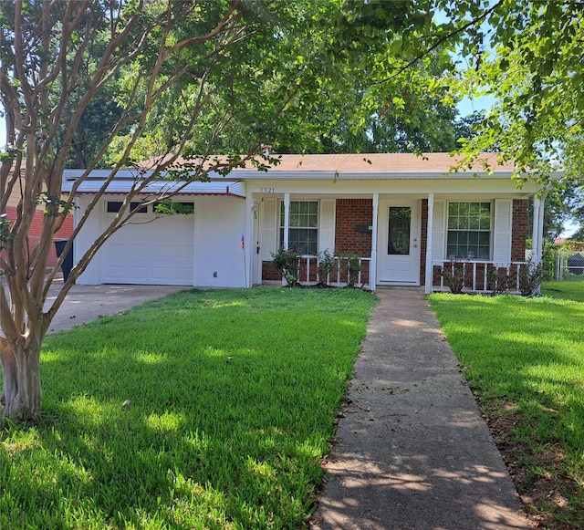 ranch-style home with a front yard, a porch, and a garage