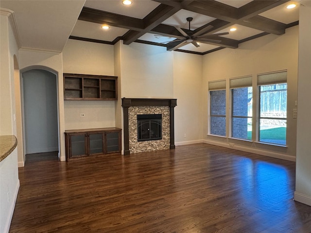 unfurnished living room with beamed ceiling, a fireplace, and coffered ceiling