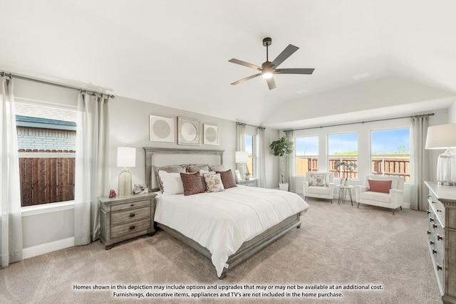 bedroom with multiple windows, ceiling fan, light carpet, and vaulted ceiling