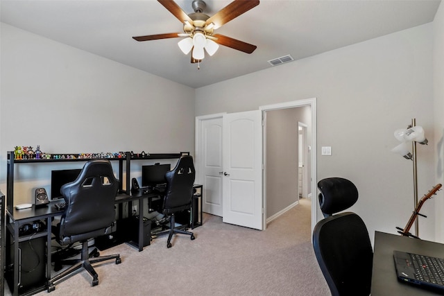 office area featuring ceiling fan and light carpet