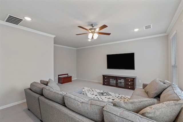 carpeted living room featuring ceiling fan and ornamental molding