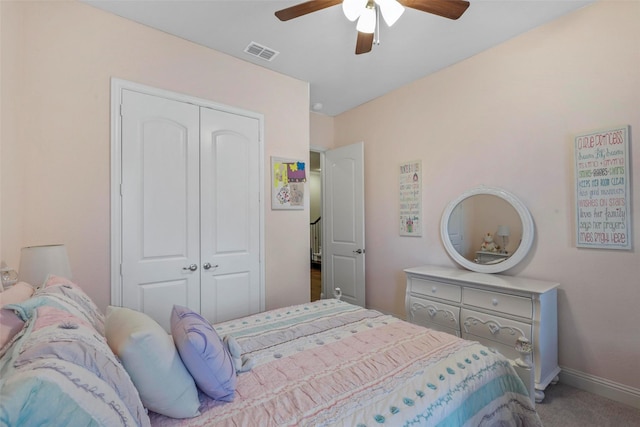 carpeted bedroom with a closet and ceiling fan