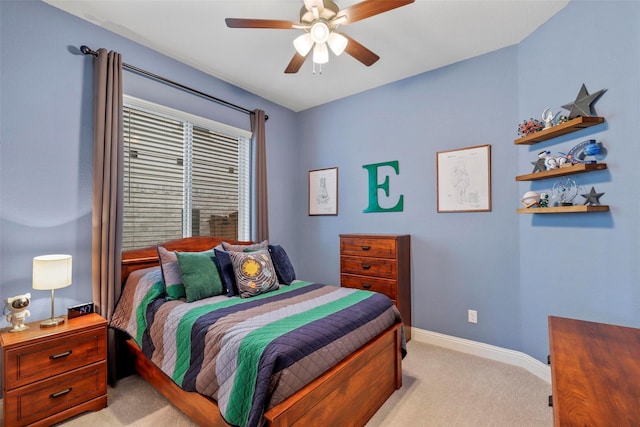 bedroom featuring ceiling fan and light carpet