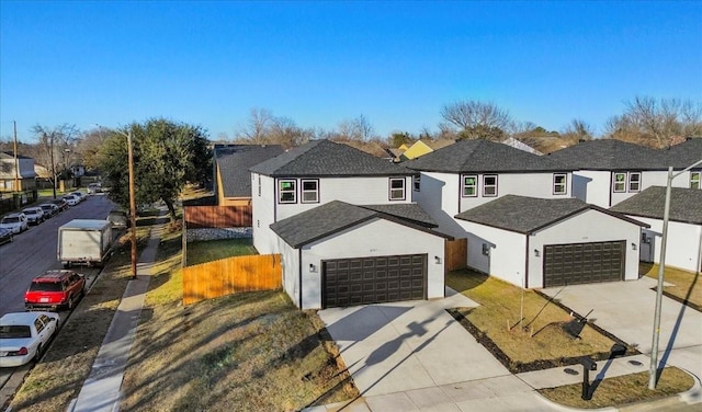 front of property featuring a front yard and a garage