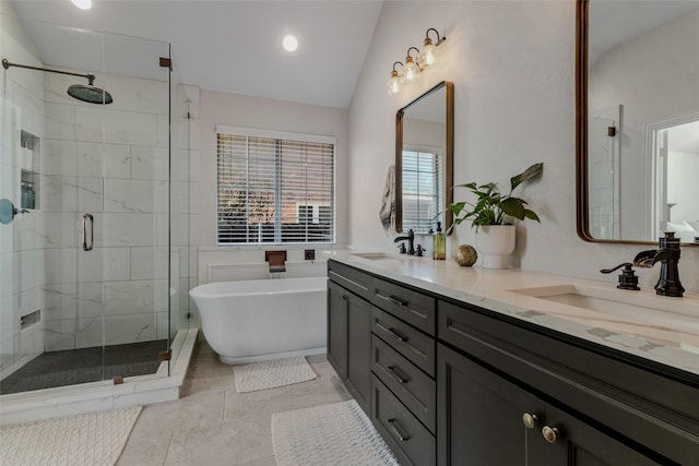 bathroom with tile patterned flooring, vanity, separate shower and tub, and lofted ceiling