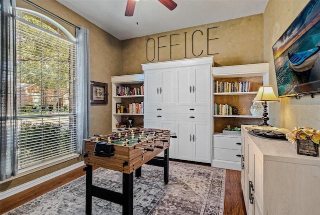 rec room with hardwood / wood-style floors and ceiling fan