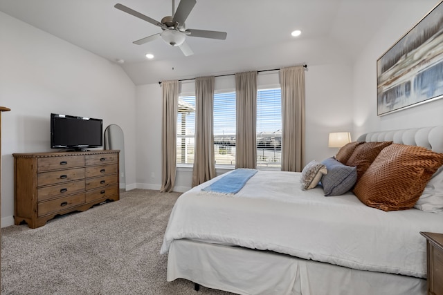 bedroom with light carpet, vaulted ceiling, and ceiling fan