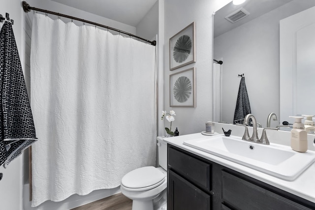 bathroom featuring hardwood / wood-style floors, vanity, and toilet