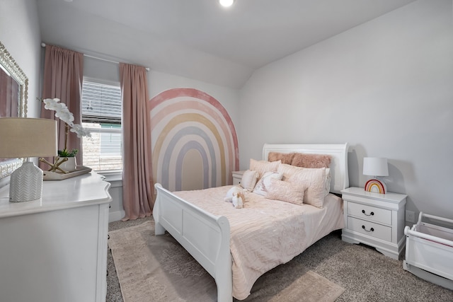 bedroom with lofted ceiling and carpet floors