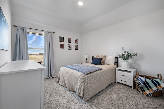 bedroom featuring light carpet