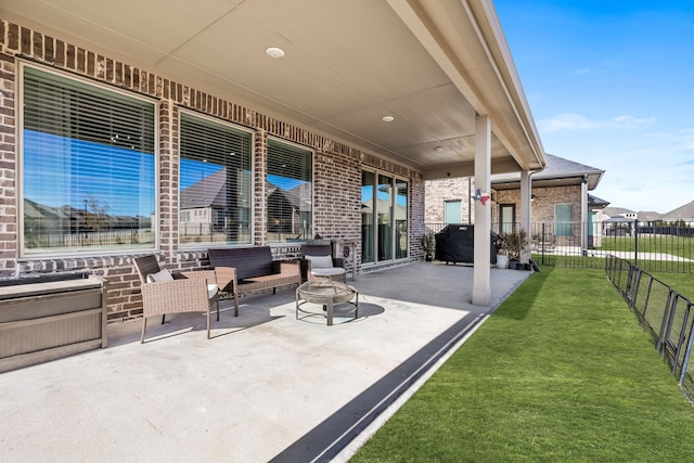 view of patio featuring an outdoor living space with a fire pit