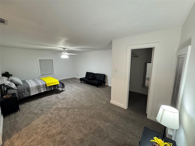 bedroom with ceiling fan and dark colored carpet