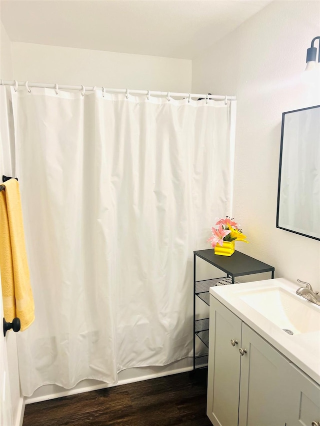 bathroom with vanity and hardwood / wood-style floors