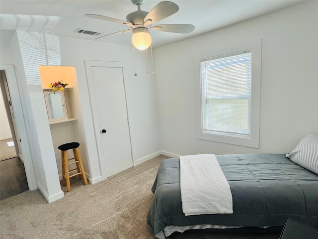 carpeted bedroom featuring ceiling fan