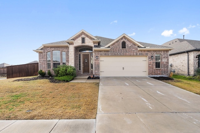 view of front facade with a garage and a front yard