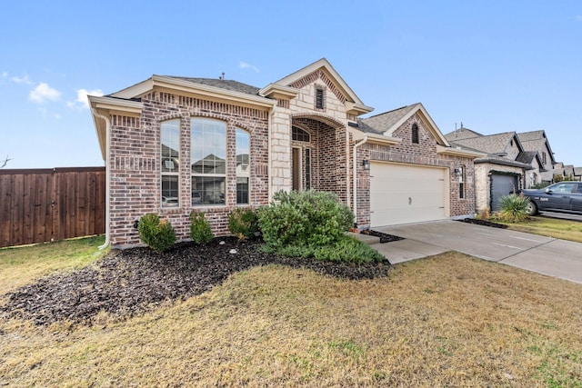 view of front of house featuring a front yard and a garage