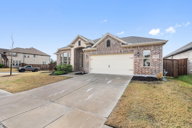 view of front of house with a front yard and a garage