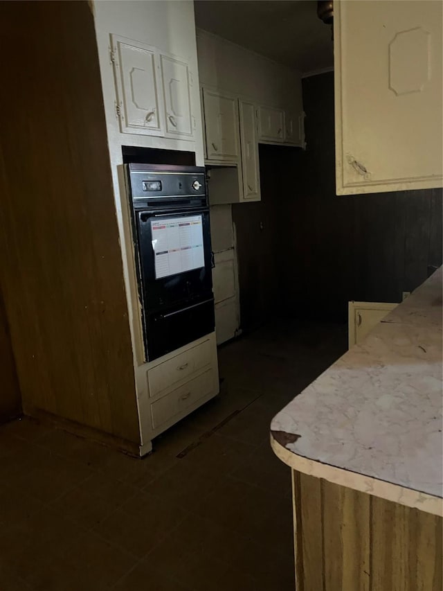 kitchen with double oven and white cabinets