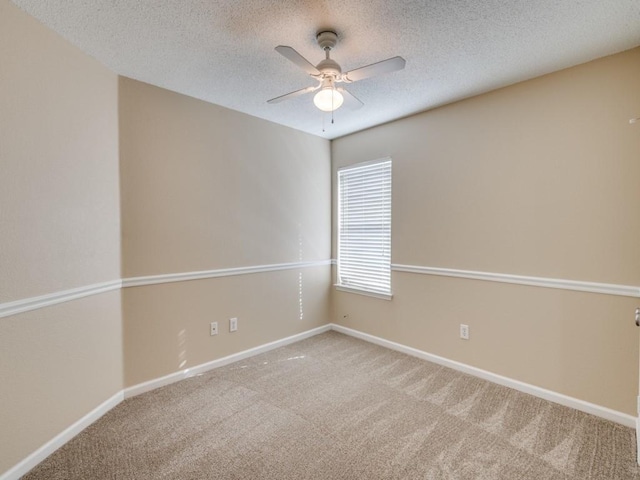 unfurnished room featuring carpet, a textured ceiling, and ceiling fan