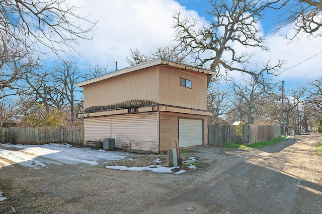 view of home's exterior with central AC