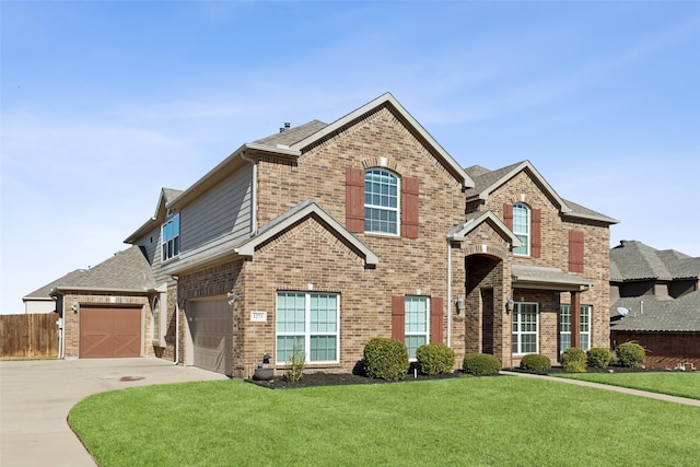 view of front property with a garage and a front yard